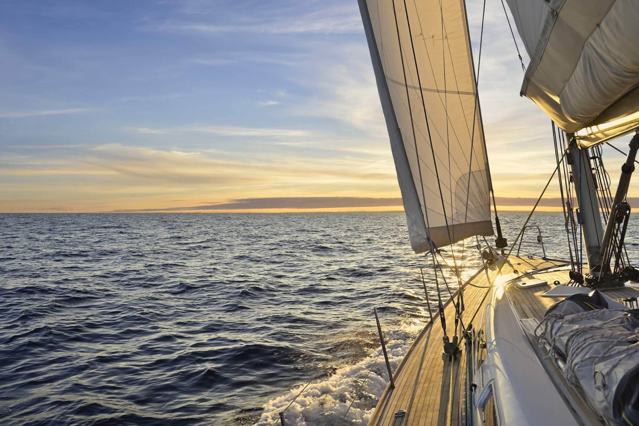 Sailboat Sailing In The Mediterranean Sea At Sunset
